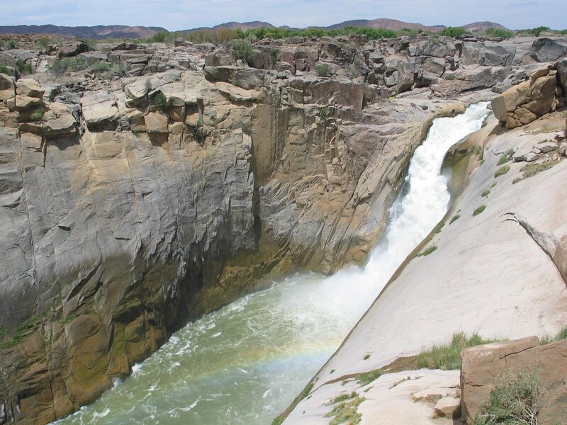 Waterfall in Canyon — Brown, Dramatic, Afternoon, Photograph, River, Rainbow
