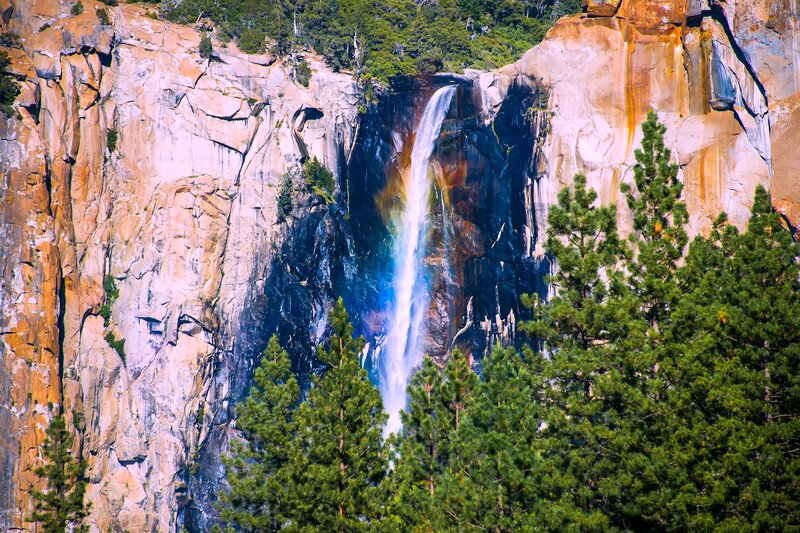 Waterfall in Canyon — Green, Dramatic, Afternoon, Photograph, Trees, Cliffs, Rainbow