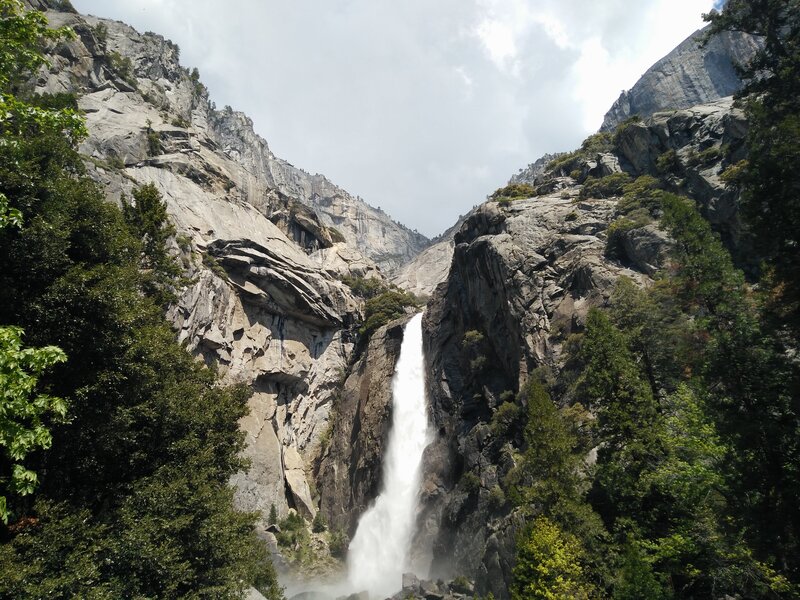 Waterfall in Canyon — Green, Dramatic, Afternoon, Photograph, Trees, Rocks, Sky