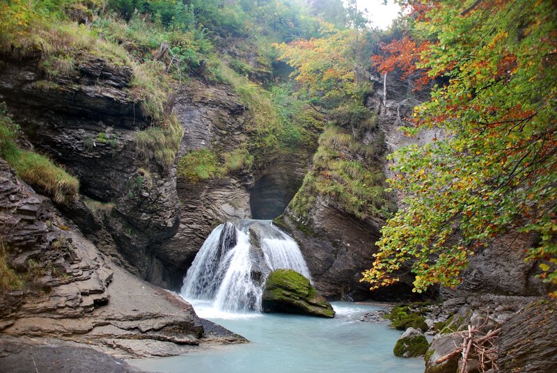 Waterfall in Canyon — Green, Serene, Autumn, Photograph, Trees, River, Rocks