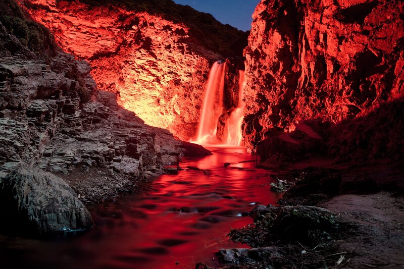 Waterfall in Canyon — Red, Dramatic, Night, Photograph