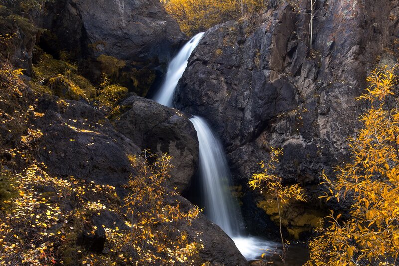 Waterfall in Canyon — Yellow, Serene, Autumn, Photograph, Rocks