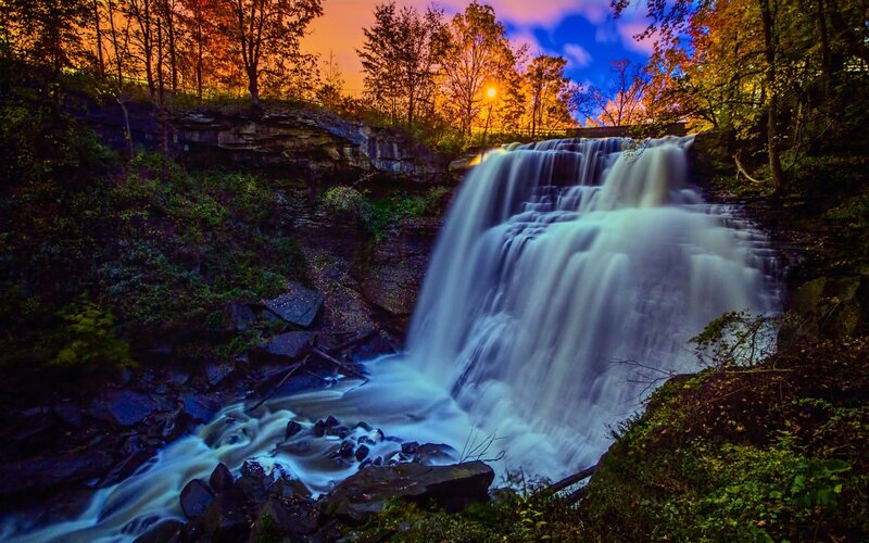Waterfall in Forest — Blue, Dramatic, Sunset, Photograph, Trees, Rocks, Sky
