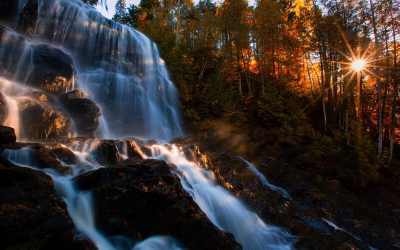 Waterfall in Forest — Blue, Serene, Sunset, Photograph, Trees, Sun
