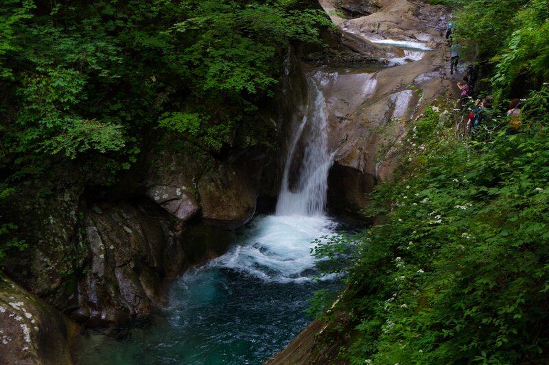 Waterfall in Forest Canyon — Green, Serene, Afternoon, Photograph, People