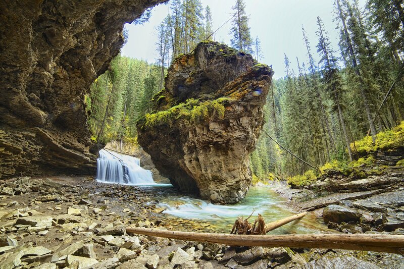 Waterfall in Forest Canyon — Green, Serene, Afternoon, Photograph, Rock Formation