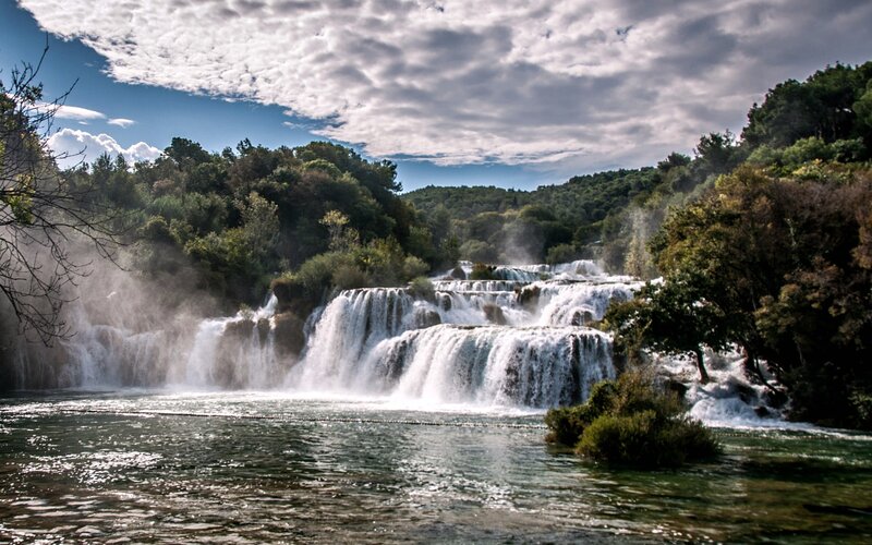 Waterfall in Forest — Green, Dramatic, Afternoon, Photograph, Trees, River, Clouds