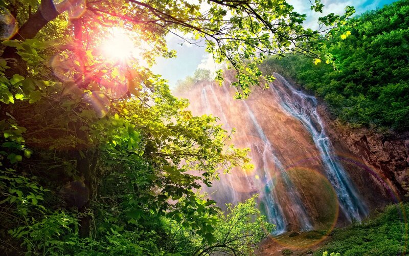 Waterfall in Forest — Green, Serene, Afternoon, Photograph, Trees, Sunlight, Rock, Rainbow