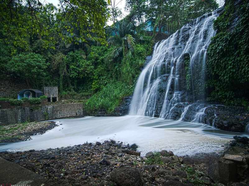 Waterfall in Forest — Green, Serene, Morning, Photograph, Trees, Rocks, Building