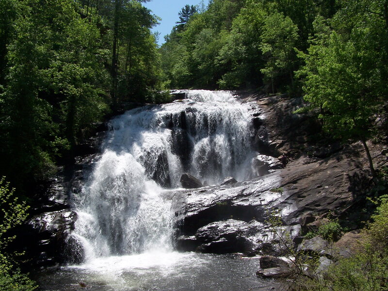 Waterfall in Forest — Green, Serene, Summer, Photograph, Trees, Rocks, Person