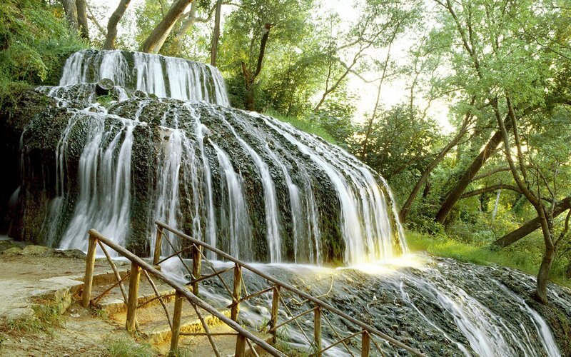 Waterfall in Forest — Green, Wooden Railing
