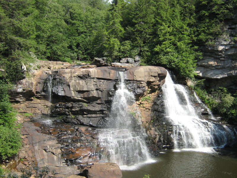 Waterfall in forested canyon