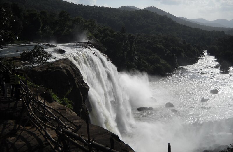 Waterfall in forested mountains