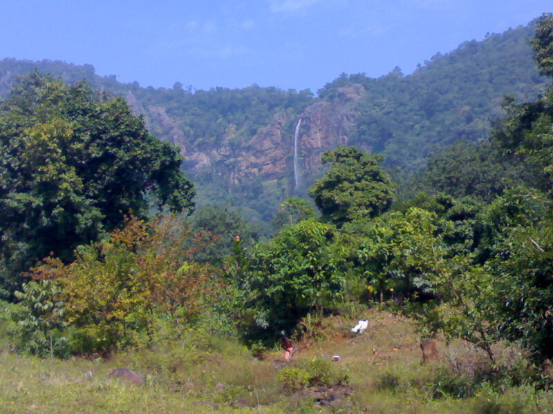 Waterfall in Forested Mountains — Green, Serene