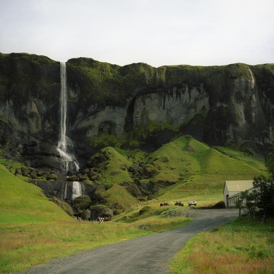 Waterfall in green landscape