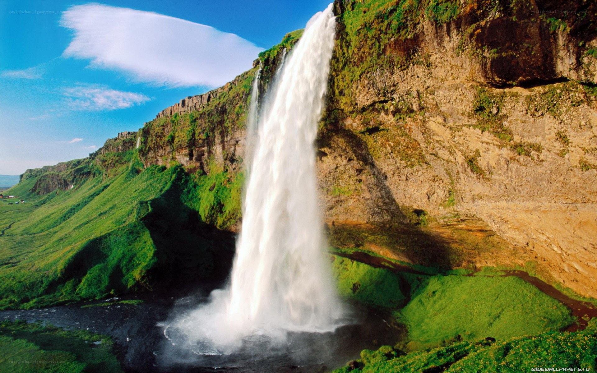 Waterfall in green landscape