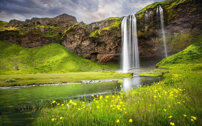 Waterfall in Green Valley — Serene, Afternoon, Photograph, River, Bridge, Flowers