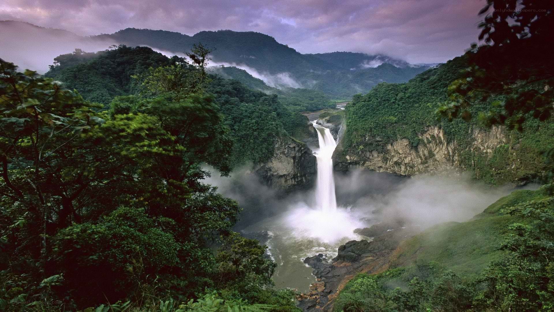 Waterfall in lush green valley