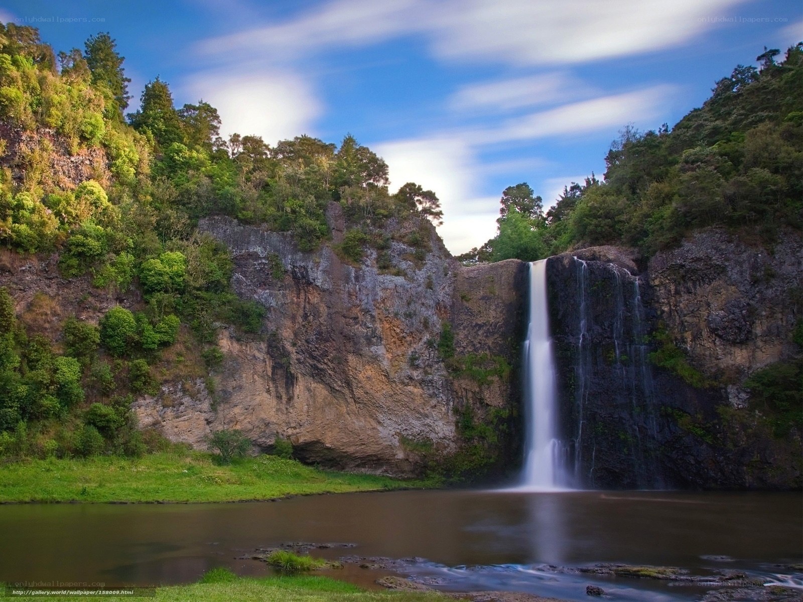 Waterfall in lush green valley