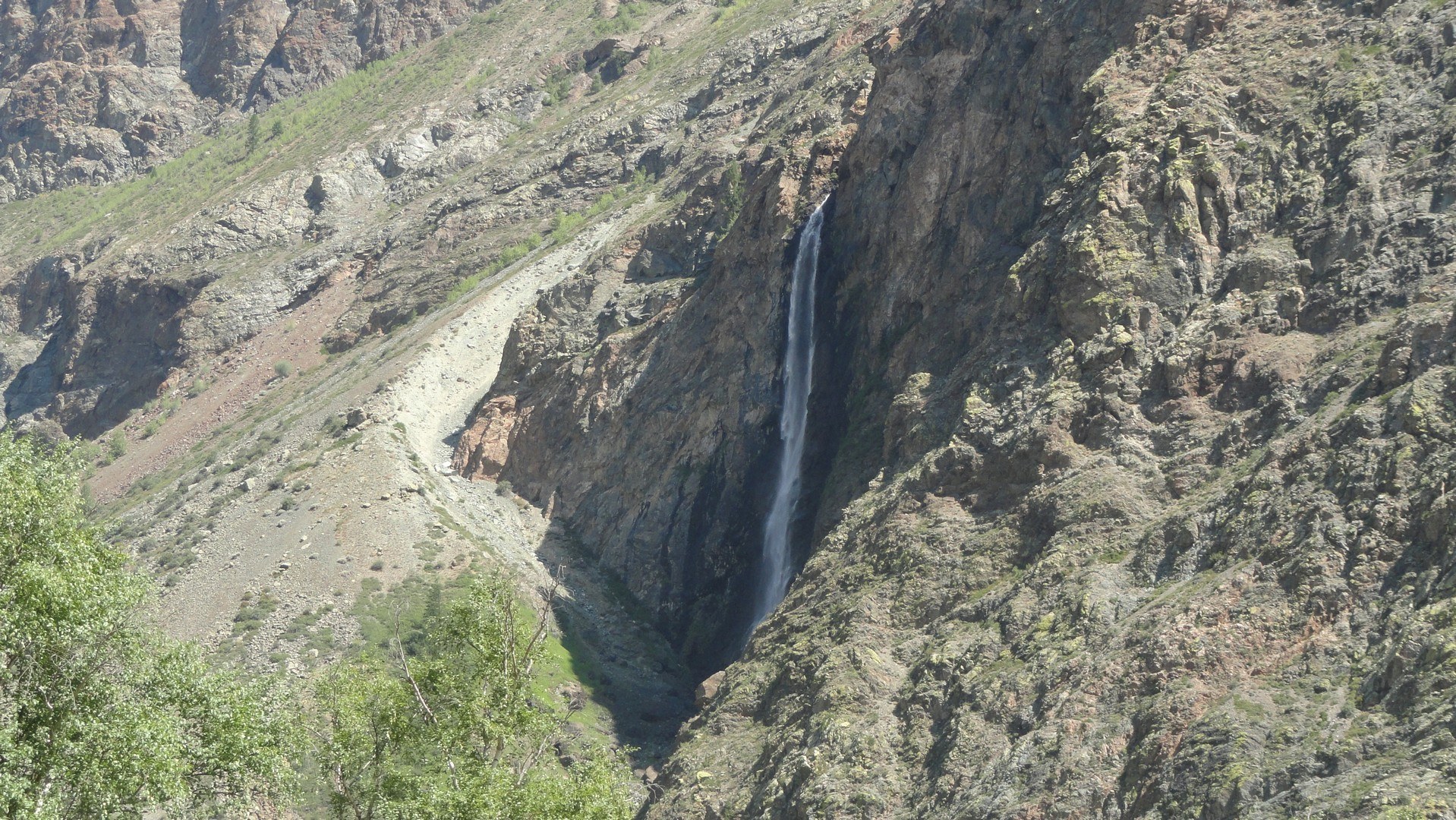 Waterfall in mountain canyon