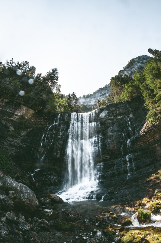 Waterfall in Mountain Gorge — Green, Serene