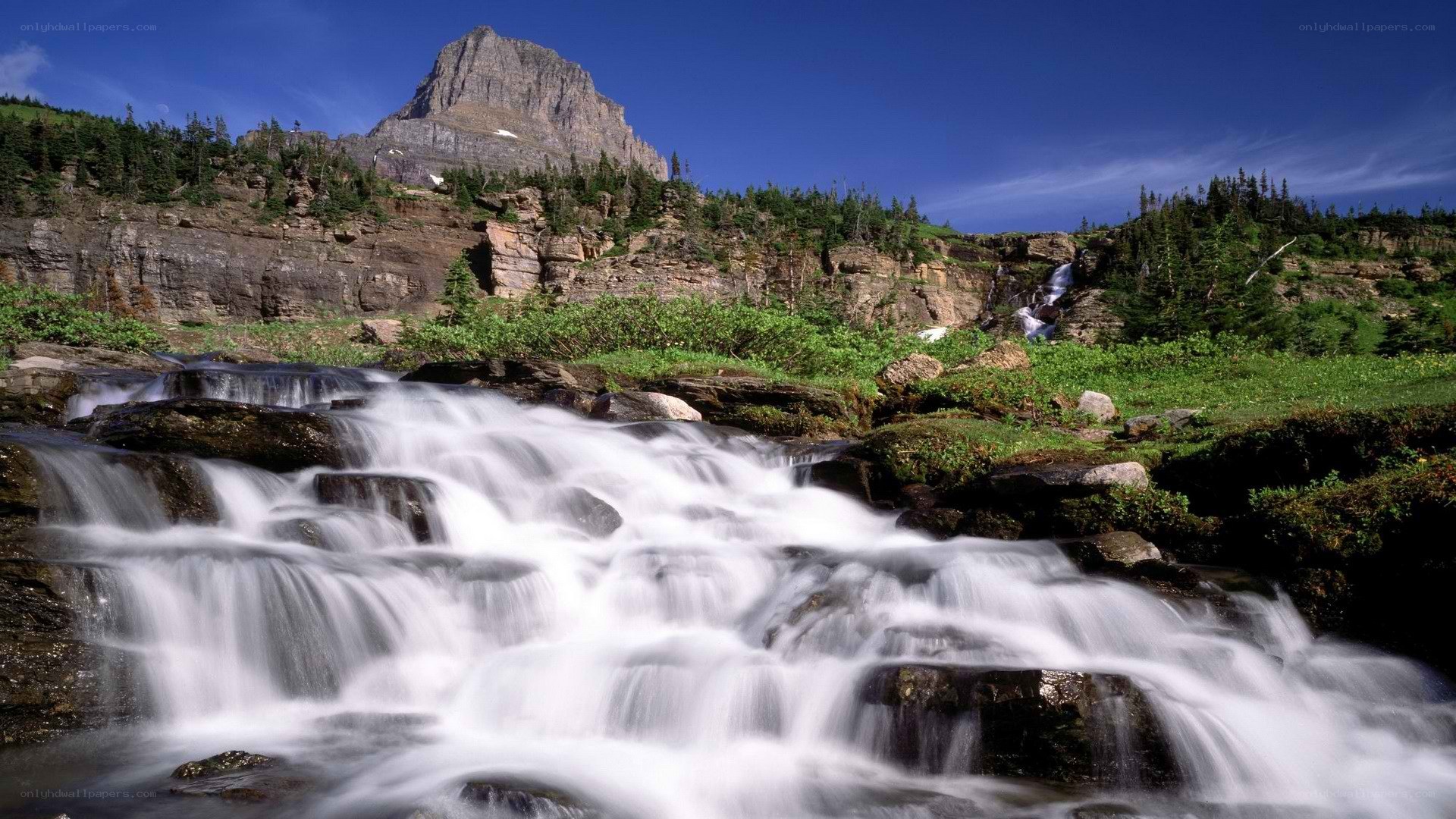 Waterfall in mountain landscape