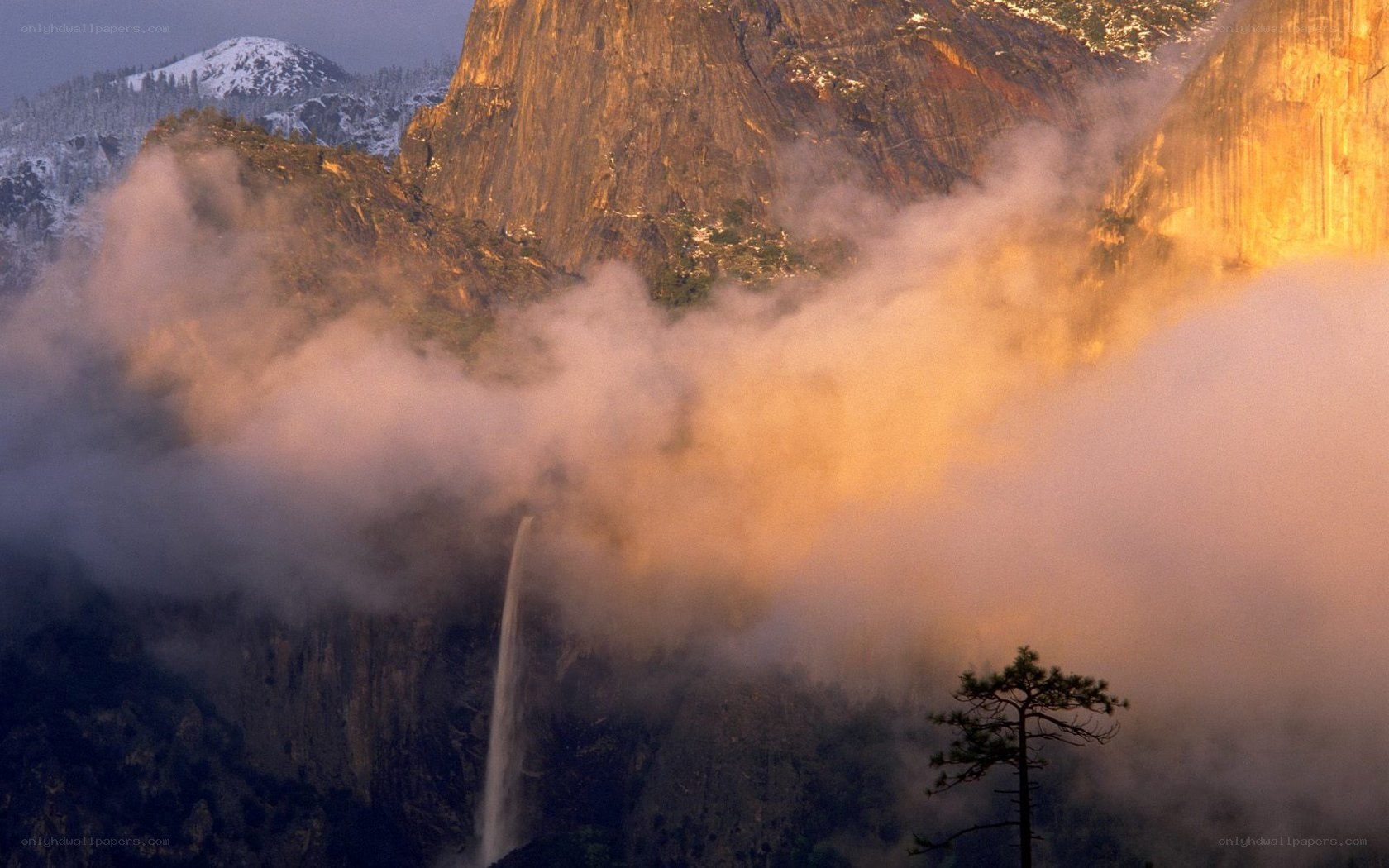 Waterfall in mountain mist