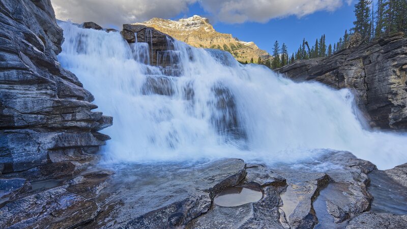 Waterfall in mountain valley