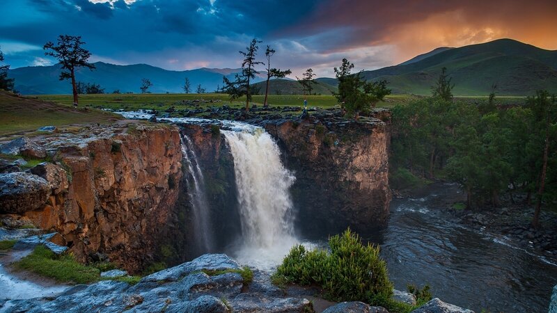 Waterfall in Mountain Valley — Blue, Dramatic, Sunset, Photograph, Mountains, Trees