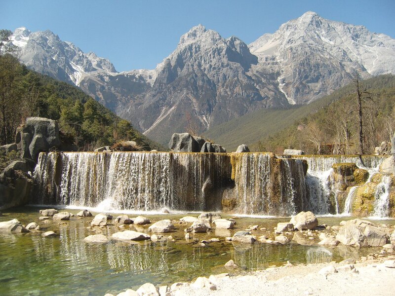 Waterfall in Mountain Valley — Blue, Serene, Afternoon, Photograph, Mountains, Trees, Rocks