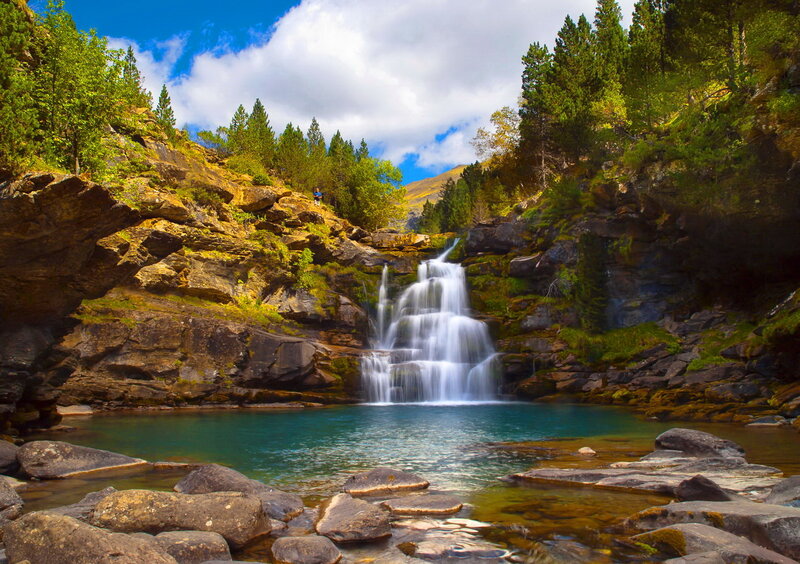 Waterfall in Mountain Valley — Blue, Serene, Afternoon, Photograph, Trees, Rocks