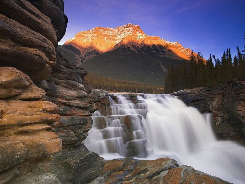 Waterfall in Mountain Valley — Blue, Serene, Sunset, Photograph, Forest, River