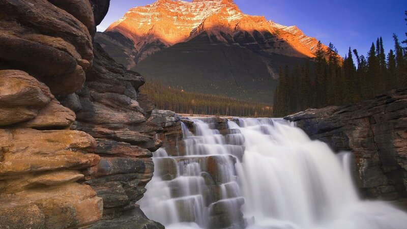 Waterfall in Mountain Valley — Blue, Serene, Sunset, Photograph, Forest