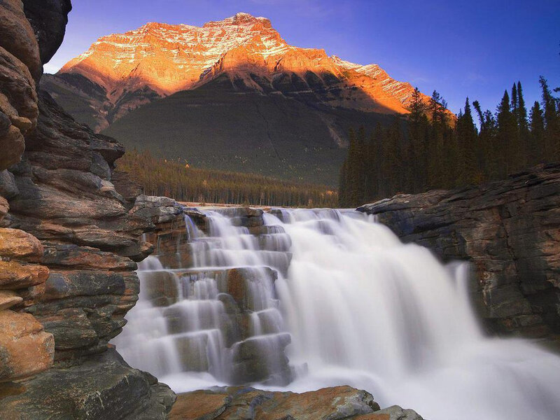 Waterfall in Mountain Valley — Blue, Serene, Sunset, Photograph