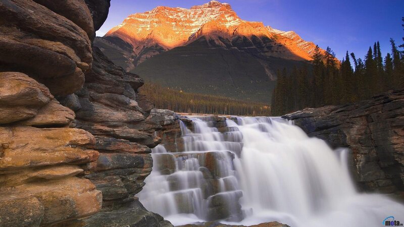 Waterfall in Mountain Valley — Blue, Serene, Sunset
