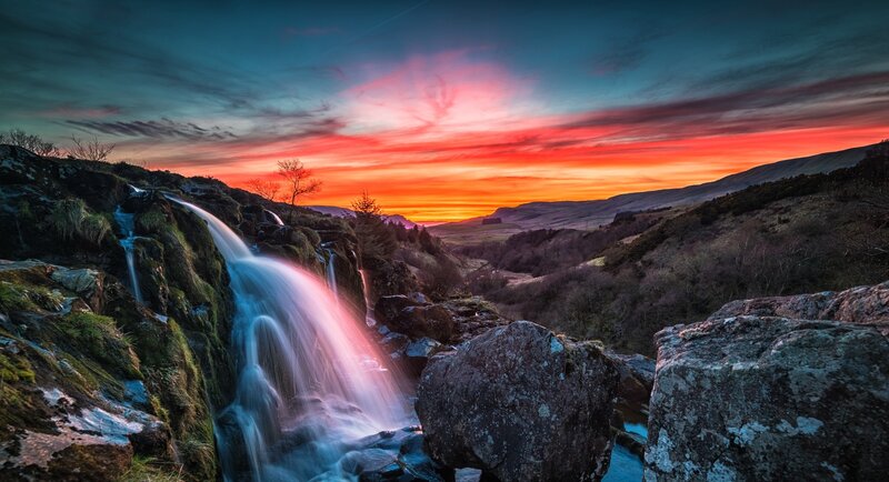 Waterfall in Mountain Valley — Orange, Dramatic, Sunset, Photograph