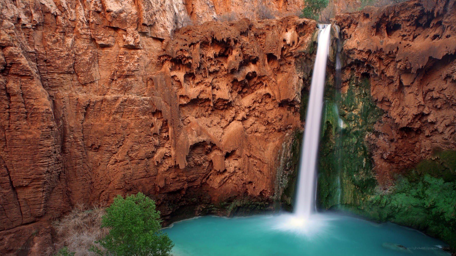 Waterfall in red rock canyon