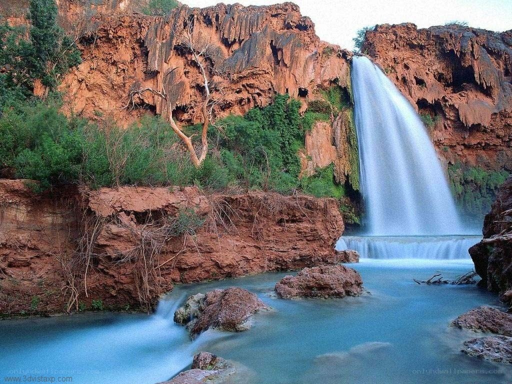 Waterfall in red rock canyon