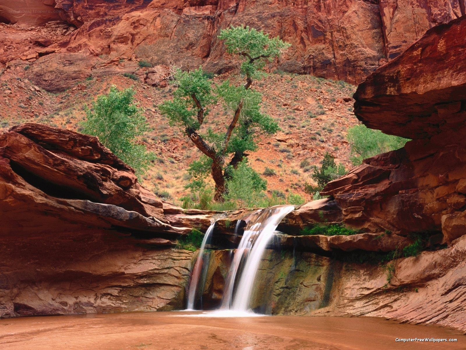 Waterfall in red rock canyon