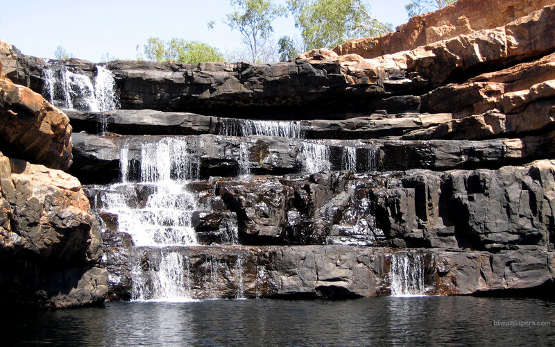 Waterfall in Rocky Canyon — Brown, Serene, Afternoon, Photograph, Rocks