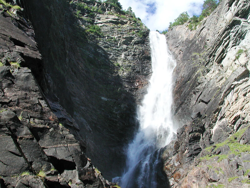 Waterfall in Rocky Canyon — Gray, Dramatic