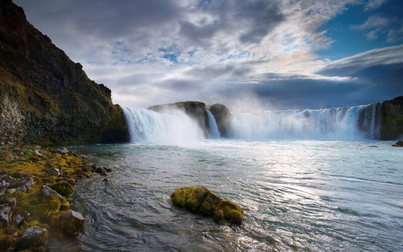 Waterfall in Rocky Landscape — Blue, Dramatic, Afternoon, Photograph, Rocks