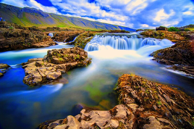 Waterfall in Rocky Landscape — Blue, Dramatic, Afternoon, Photograph