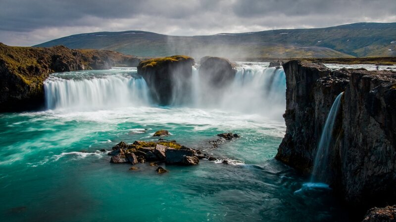 Waterfall in Rocky Landscape — Blue, Dramatic, Photograph