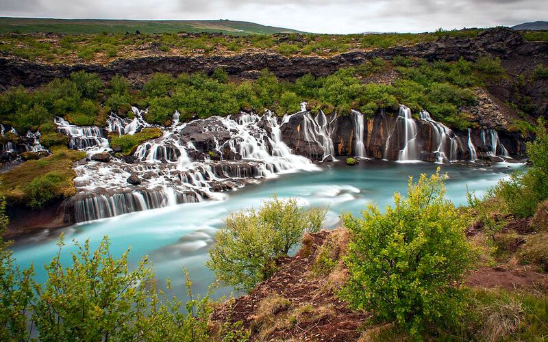 Waterfall in Rocky Landscape — Green, Serene