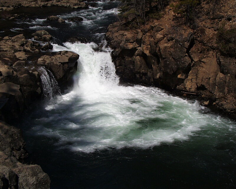 Waterfall in rocky river canyon