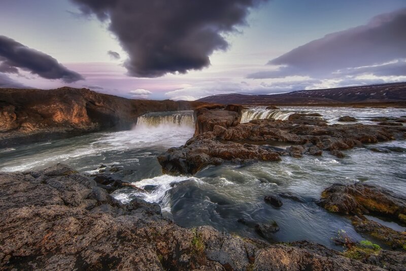 Waterfall in rugged landscape