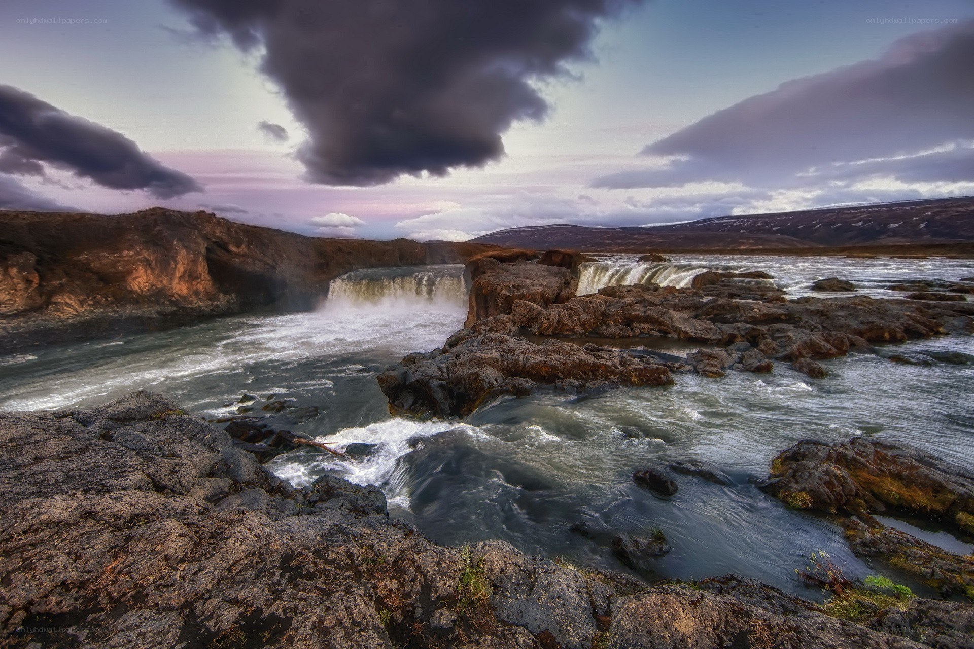 Waterfall in rugged landscape