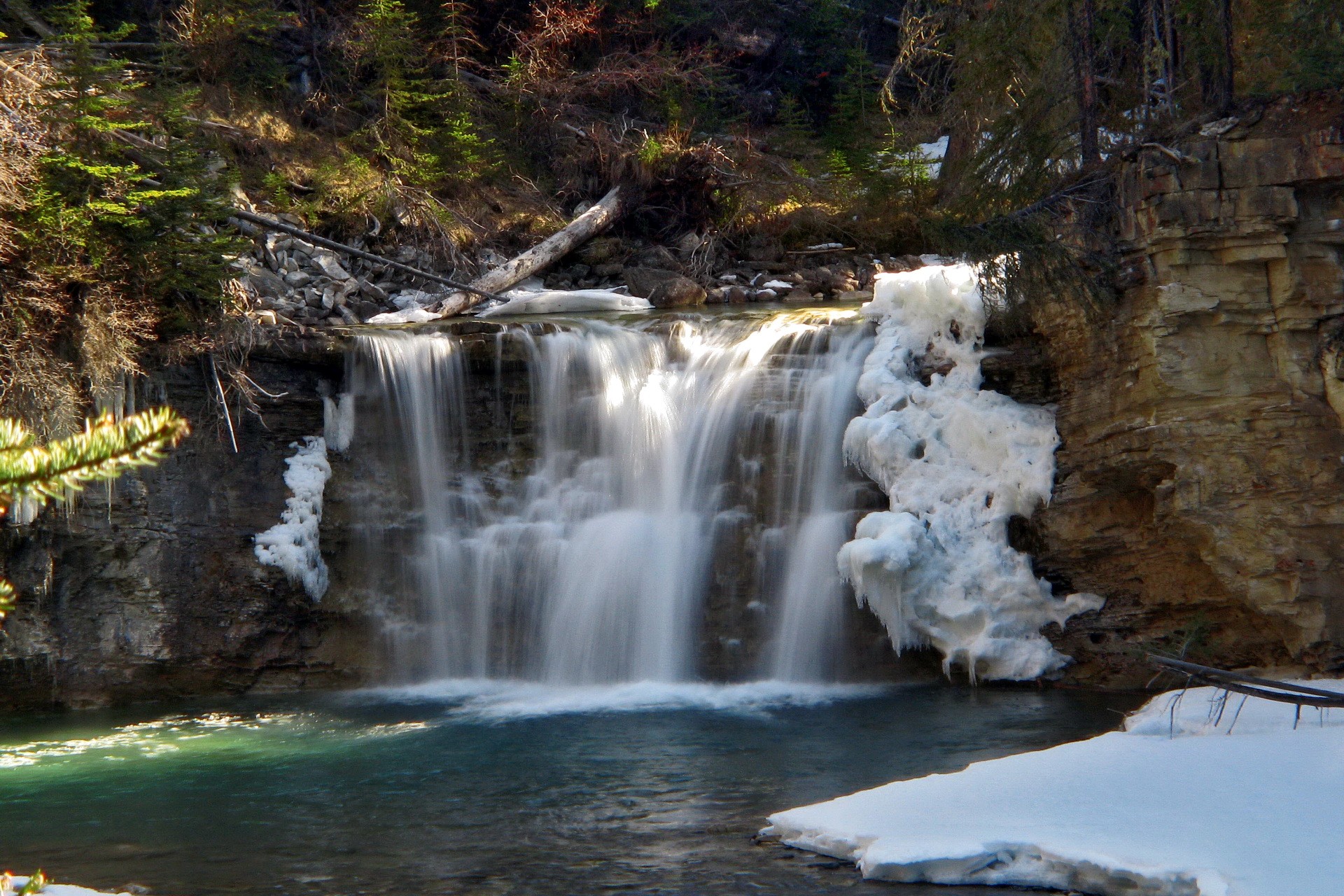 Waterfall in snowy forest