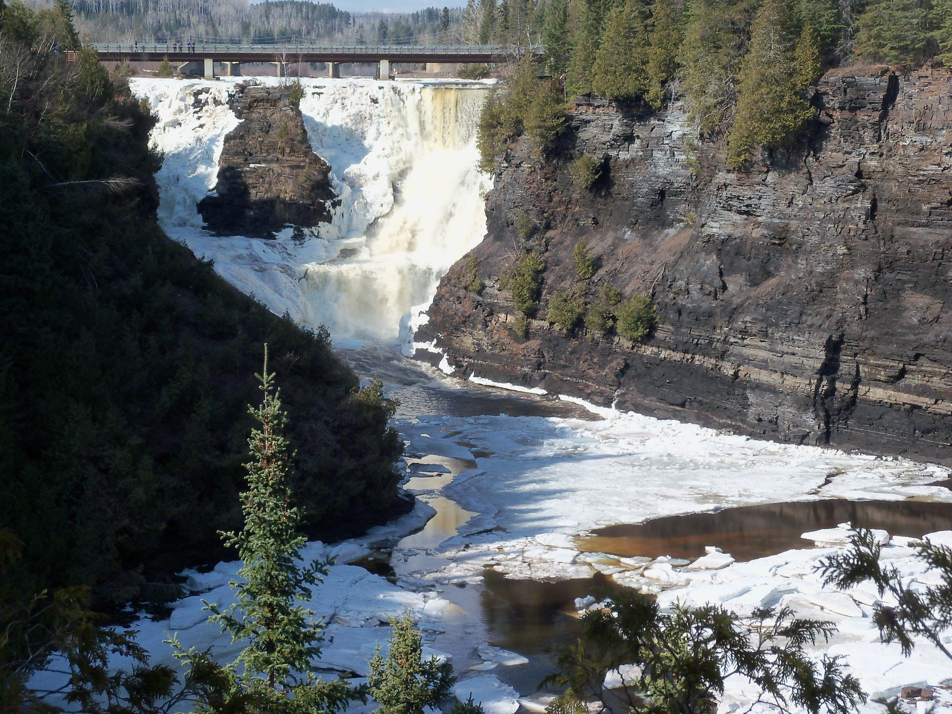 Waterfall in winter landscape